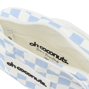 Close-up of a blue and white checkered pouch with 'oh coconuts' branding.