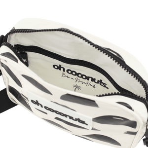 white and black crossbody bag with oh coconuts branding