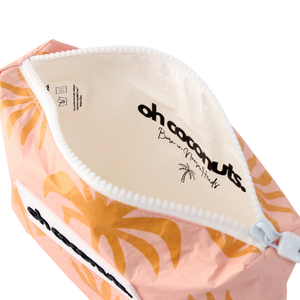 Pink pouch with orange floral pattern and 'oh coconuts' branding on a white background