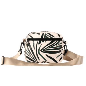 Crossbody bag with leaf pattern on a black background