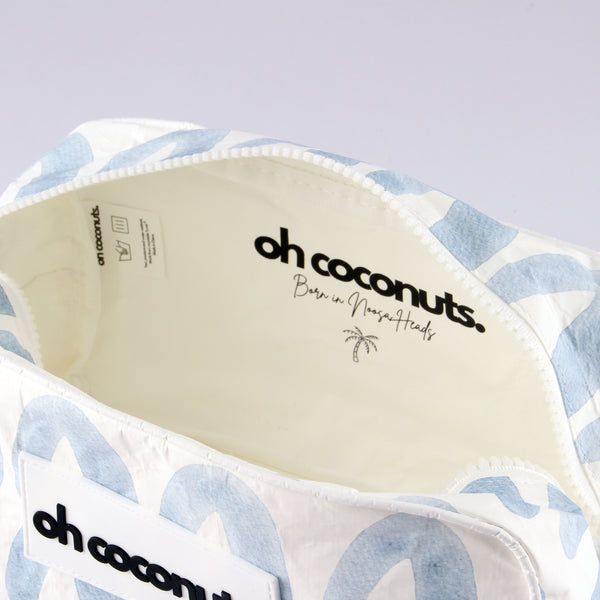 Cosmetic bag with oh coconuts born in noosa heads stamp and palm tree details. 