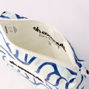 Born in Noosa Heads stamped into medium blue wave beach pouch and clutch