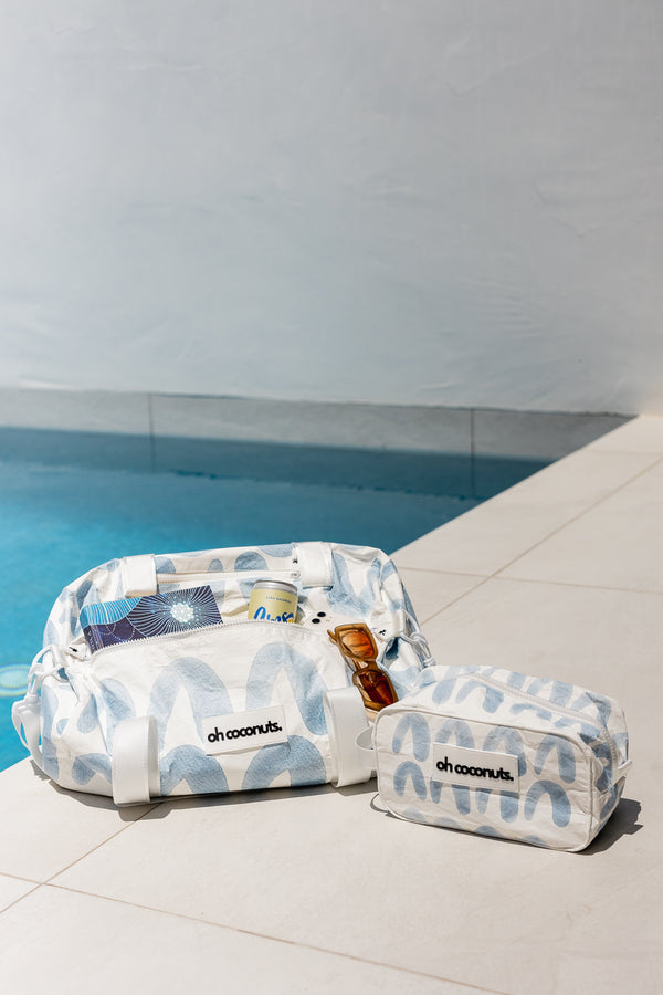 Matching duffel and bathroom cosmetic bag with water resitant material. 