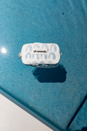 Bathroom cosmetic bag floating in aqua pool in water resistant material