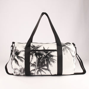 gym and overnight bag with white and black palm tree design. multiple pockets and zips. 