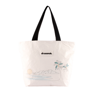 Tote bag with palm tree design and 'oh coconuts' text on a white background