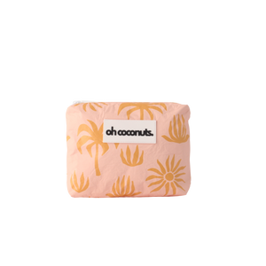 Pink pouch with yellow palm tree pattern and 'oh coconuts' label on a white background