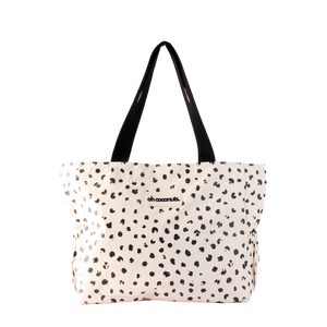 Tote bag with black dot pattern and 'oh coconuts' branding on a white background