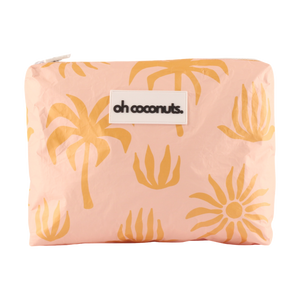 Pink pouch with yellow plant patterns and 'oh coconuts' label on a white background