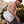 a shirtless model carrying a duffel gym bag white with blue arches crossbody